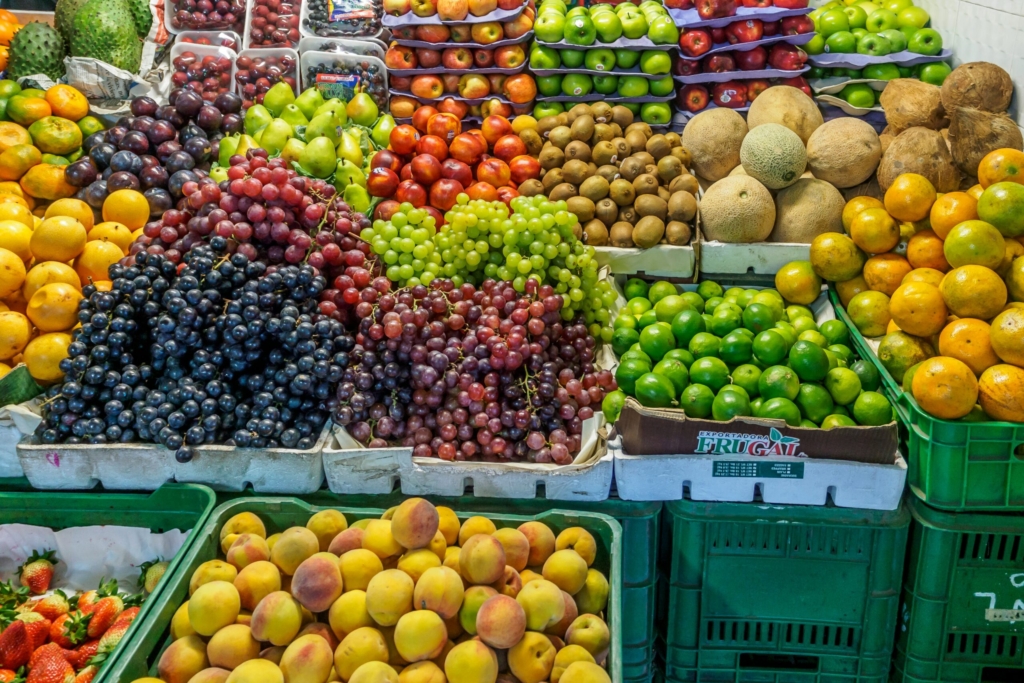 green and red apples on blue plastic crate